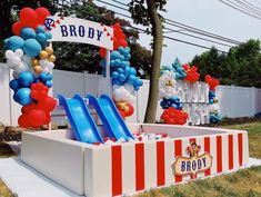 balloons and streamers decorate the entrance to a circus themed birthday party at broddy's