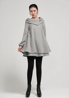 "Easy + oh-so breezy wool dress from Xiaolizi. The gray wool tunic dress made from a soft wool fabrication in a loose fitting +above knee length. The cute dress topped with a mockneck + long sleeves with special collar at the front. DETAILS * Wool blend * 35% wool , 40% fiber, 25% nylon * Fully satiny lined * Two pockets on each side * large chunky collar * double layer hemline * Asymmetric dress * Plus size dress, oversized dress * Spring, Autumn, winter * Wash by hand or machine with cold wate Lagenlook Workwear Dresses For Fall, Oversized Gray Fall Dress, Womens Dresses Casual, Winter Wool Dress, Wool Tunic, Winter Tunic, Dress Pockets, Asymmetric Dress, Dresses Casual Winter