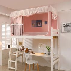 a loft bed with a desk underneath it and a ladder to the top that leads up