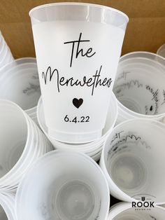 white cups with the names of people on them