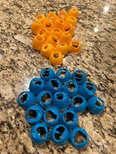 several blue and yellow vases sitting on top of a marble counter