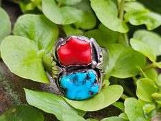 Circa 1980, handmade sterling silver Kingman turquoise & coral ring. Size 12.5. Not stamped but tested for sterling. Measures approx. 21.8 x 18.6mm. Weighs 11.6 grams. Older patina is prevalent; however, polishing can be provided prior to shipping with an extra fee, should you desire. Thanks for looking. ERA - Circa 1980, Vintage METAL / MATERIAL - Sterling Silver  SIZE / MEASUREMENTS - Size 12.5 / Measures approx. 21.8 x 18.6mm. Weighs 11.6 grams. CONDITION - Older patina is prevalent, however Southwestern Style Red Turquoise Ring, Coral Ring, Kingman Turquoise, Coral Turquoise, Metal Material, Handmade Sterling Silver, Antique Items, Rings Statement, Vintage Metal