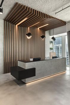 an office lobby with wooden slats on the wall