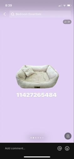 a white dog bed on top of a purple background with the number 1 below it