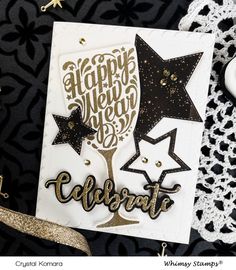 a happy new year's card with gold foil stars and glitter on the bottom