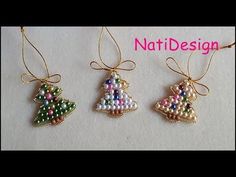 three beaded christmas ornaments hanging from strings on a white surface with the words natdesign