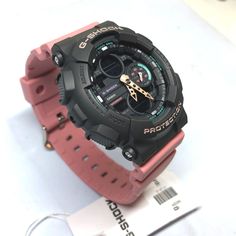 From the G-SHOCK S-Series of highly popular analog-digital watch comes new model with new face and hand design. As with the G-SHOCK GA-140, these models features a motif that resembles a 90's stereo component device or portable music player that has been updated to a modern refined look. Subdued pink and blue, purple, and lime coloring matches the hues of modern sneakers. Boasting the classic G-Shock look with an urban upgrade, this women's watch features a black analog digital dial with pink, t Pink Casual Watches, Casual Watches With Stopwatch For Streetwear, Portable Music Player, Hand Design, 90s Colors, Music Player, Casio G Shock, Gshock Watch, Music Players