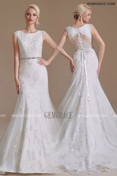 two women in wedding gowns standing next to each other with their hands on their hips