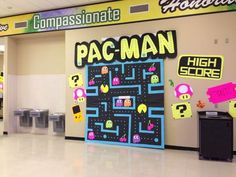 a pacman game is on display in the hallway