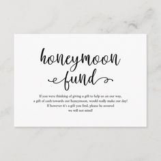 a white business card with the words honeymoon fund written in cursive writing on it