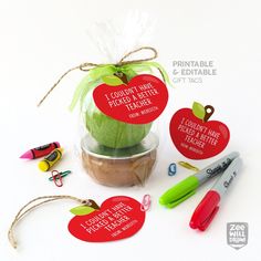 an apple in a jar with some writing on it and other items around the package