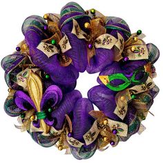 a purple wreath with green and gold decorations