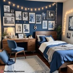 a bedroom decorated in blue and white with string lights on the wall above the bed