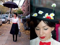 a woman wearing a hat with daisies on it and an umbrella over her head