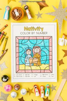 the nativity color by number book surrounded by other christmas decorations