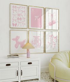 a living room with pink and white art on the wall