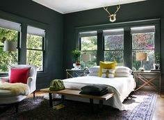 two different rooms with green walls and white furniture, one in yellow and the other in red