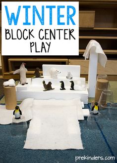 the winter block center play is set up with penguin figurines and paper towels