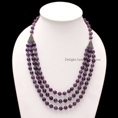 PRODUCT DETAIL : ITEM : AMETHYST BEADED NECKLACE ITEM CODE : DGC4095 ITEM NAME :NECKLACE GEMSTONE : AMETHYST BEADS SHAPE : SMOOTH ROUND LENGTH : 21 INCH APPROX BEADS SIZE: 8MM/3.5MM Approx. WEIGHT : 474 Cts. APPROX CUSTOMIZATION/BULK ORDER : AVAILABLE PLEASE FEEL FREE TO CONTACT IF YOU REQUIRE ANY FURTHER INFORMATION.