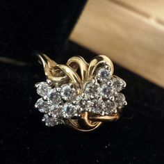 a gold ring with white diamonds on it