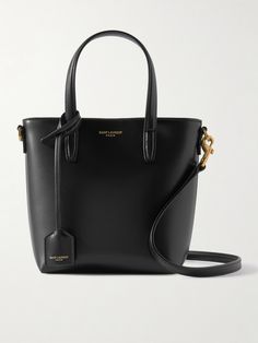 SAINT LAURENT's tote is a scaled-down version of its iconic shopper. Made in Italy from smooth leather, it has top handles and a detachable shoulder strap, so you can wear it cross-body. The interior is sized for must-have essentials, like your cardholder, lipstick and sunglasses. Porter Bag, Saint Laurent Tote, Boot Pumps, Saint Laurent Bag, Net A Porter, Body Bag, Smooth Leather, Leather Tote, Mini Bag