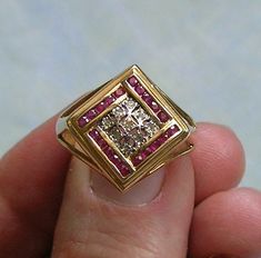 "Vintage 14k Gold, Diamond and Ruby Ring, 14K Ruby and Diamond Ring, Ring With Rubies and Diamonds  Beautiful vintage 14k yellow gold, diamond and ruby ring circa the 1980's.  The ring features 20 channel set rubies that are 1 pt a piece and 9 diamonds that are 1/2 pt a piece.  The ring has square shoulders with open sides.  The ring is marked 14K with another hallmark that I cannot make out.  A very pretty vintage ring.  The ring is a size 8. ♦ Age - Approximately 1980's ♦ Metal/Material - 14k Square Shoulders, Diamond And Ruby Ring, Rubies And Diamonds, Ruby And Diamond Ring, Ruby Diamond, Channel Set, Multi Stone Ring, Ruby Ring, Vintage Ring