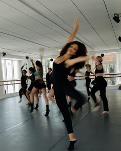 a group of people dancing in a dance studio