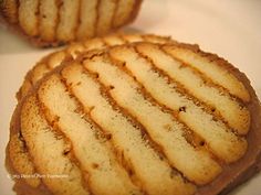 some cookies are sitting on a white plate