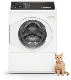 a cat sitting next to a washing machine