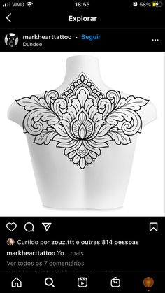 the back of a mannequin with an intricate design on it's chest