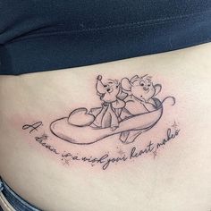 a pregnant belly with winnie the pooh tattoo on it's side, and an inscription