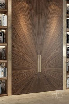 a large wooden door sitting next to a book shelf