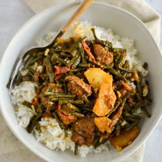 a white bowl filled with rice and meat