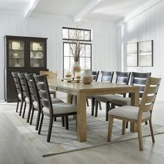 a dining room table with chairs around it