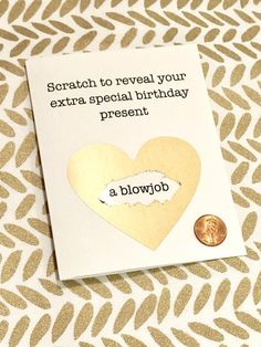 a birthday card with a heart cut out and a penny on the side that says, scratch to reveal your extra special birthday present