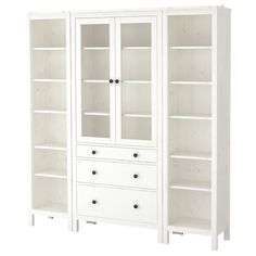 a white bookcase with drawers and shelves