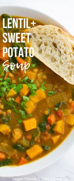 lentil and sweet potato soup in a white bowl with a piece of bread on top