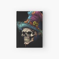 a skull wearing a witches hat hardcover book