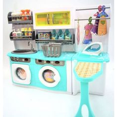 a toy kitchen with blue and white appliances