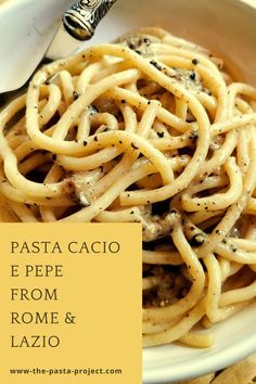 pasta with pesto and parmesan cheese in a white bowl