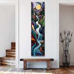 a painting hanging on the wall next to a wooden bench