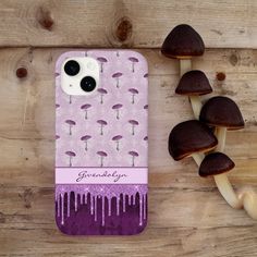 a purple phone case with mushrooms on it