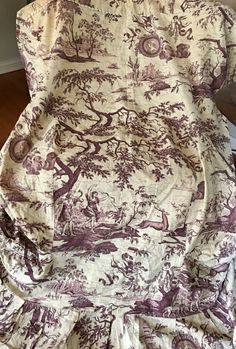 a chair covered in a purple and white toiler print