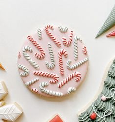 some cookies are decorated with candy canes and icing