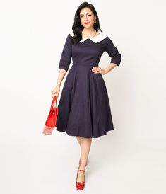 This 1950s-inspired beauty from Collectif is perfect for any occasion. The rich navy color paired with the crisp white collar creates an elegant and timeless look that will make you feel like a true vintage queen. This dress also offers practicality with its convenient side pockets, perfect for stashing your essentials while on the go. The three-quarter length sleeves add a touch of sophistication, while the back zipper ensures easy dressing.Available in sizes UK 8-UK 20.Belt not included.Crinol Easy Dressing, Color Pairing, Vintage Inspired Dresses, Dresses Uk, Navy Color, White Collar, Navy White, True Vintage, Swing Dress