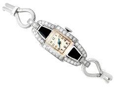 "An impressive vintage Art Deco 0.95 carat diamond and black onyx, platinum cocktail watch by 'Hamilton'; part of our diverse antique jewellery and estate jewelry collections. This impressive vintage Art Deco diamond watch has been crafted in platinum. The watch has a rectangular dial with plain black Arabic hour numerals displayed within rectangular designs, the outer one marked as the chapter ring. The Art Deco watch is fitted with shaped, blued steel hands, and the face clearly displays the t Cocktail Watch, Art Deco Watch, Art Deco Lady, Deco Jewelry, Art Deco Diamond, Women Wrist Watch, Art Deco Jewelry, Diamond Watch, Antique Jewellery