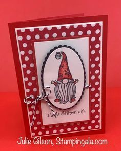 a red and white card with a gnome on it