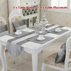 a dining room table with chairs and placemats on it for sale in the store