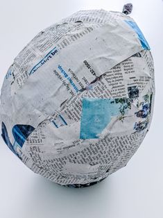 a paper mache ball sitting on top of a table