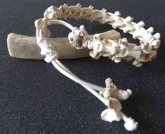 A bracelet for her and for him. It is an attractive addition to any outfit. It is made of natural animal bones, properly prepared. The bones are connected with a jewelry cord, waxed, white, which is braided using the macramé technique. Thanks to its shiny structure, the product looks very attractive! The smallest circumference of the bracelet is 18 cm, but thanks to the movable, braided adjustment, the length can be adjusted to a much larger wrist circumference. Bones in natural white color. 100 Bone Bracelet, Bones Bracelet, Bracelet For Her, Animal Bones, Braided Bracelets, Halloween Shopping, Poland, Bones, Macrame